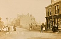 An early view of Leabrooks, F. Balls Shop with the railings to the chapel seen at the side of the building. Most people seem to be posing for the cameraman. The photograph dates from the very early 1900s.