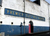The Premier Electric Theatre showing the original sign and emergency exit onto Victoria Street, Somercotes