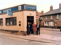 The Derbyshire Building Society Situated at the junction of Leabrooks Road and Victoria Street, Somercotes. This branch office closed in 2013, when the photograph was taken. L/R Hillary Houyndslow, Julie Nicholls, Julie Cooper & Ernie Perkins (Manager)