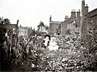 Photograph of children in the garden of the bottom house in Queen Street off Birchwood lane taken in 1905.