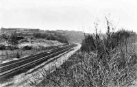 View of Alfreton Main Railway Line running along the back of William Bush & Son Ltd. recycling yard.