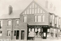 The grocer's shop of H.Gill, on the corner of High Street and Cressy Road, Alfreton. The photograph probably dates from around the early 1920s.