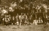 Some of the local miners with their children and dogs line up for this photograph after a games of cricket end of August 1905.