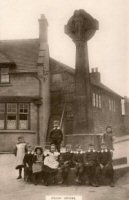 Children at Crich Cross early 1900s the Jolly Dutchman Inn behind