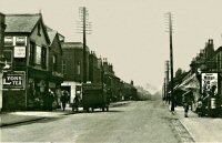 Nottingham Road, Somercotes. The Premier Electric Theatre is just left of centre. Note the Lyons Tea advertisement. The photograph dates from the 1930s, after the cinema was refurbished.