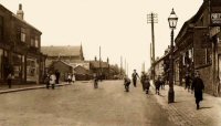 Somercotes Hill. This is a photograph looking up Somercotes Hill onto Nottingham Road. Left of centre is the Church of St. Thomas, with the Market Place just in front of the church. It probably dates from around the 1910s or 1920s.