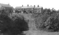 View of Pennytown Cottages and the old road from Birchwood Lane