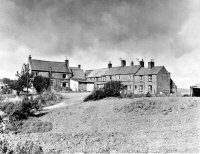 A view of the Pennytown cottages, prior to demolition.
