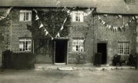 A house at Pennytown decorated with bunting. The date and occasion are not recorded, but it could be for the 1953 Coronation.