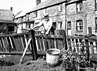 A photograph of Pennytown. The man pictured is Charlie Smith.