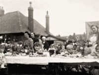 Street Party end of WWII at Brenden Avenue Norman Vertigan to left holding the tea cup