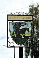 The Black Horse Inn, Lower Somercotes. The last Pub sign for the Black Horse Inn, before closure, photograph taken 2013