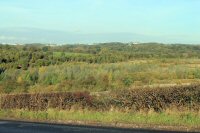 Photograph taken from Jubilee Hill in 2013 were the Acid Works once stood the Canal also past through this area. The Cotes Park Industrial Estate can be seen on the Horizon