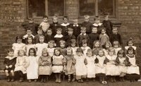 This photograph is probably taken at the old Infants School on Sleetmoor Lane. Unusually there is no mistress pictured with the children. It probably dates from the 1910s.