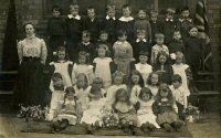 The mixed class of boys and girls probably implies that this is the infants School on Sleetmoor lane. Note the Union Flag on the extreme right. It probably dates from around 1910.