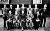 Photograph of the teachers, provided by Mr Norman Vertigan. His father George Vertigan (Maths Teacher) is seated, second from the left. Far right is Reginald Johnson (History Teacher), c.1940s