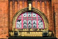 The Semi-Circular stained glass window in the faÃ§ade of the building, fronting Nottingham Road, installed as part of a 1930s refurbishment. It is a typical art-deco design of that period.