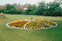 A picture of Somercotes Recreation Ground before the new developments. Flower beds near to the Bowling Green