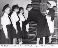 The Somercotes Red Cross Nursing Cadets at an inspection by Mrs. May Burnham and County Director Mrs. Wray.