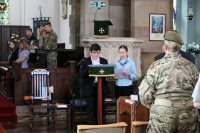 Reading the names of the fallen by young people from the Scouts and Guides 2014. Members of the Guides and Alfreton ACF can be seen.