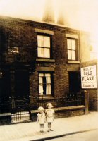 Two children outside 175 & 177 Nottingham Road, Somercotes, to the right of what is now Stores Funeral Directors.