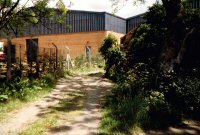 A path passing the remains of Cotes Park Farm the old building is just visible on the right photographed in 1992