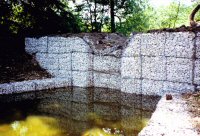 A water storage basin on the site of the old Cotes Park Farm photographed in 1992