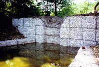 A water storage basin on the site of the old Cotes Park Farm photographed in 1992