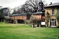 A view of the back of Riddings House showing the Clock Tower and other buildings, circa 1970's.